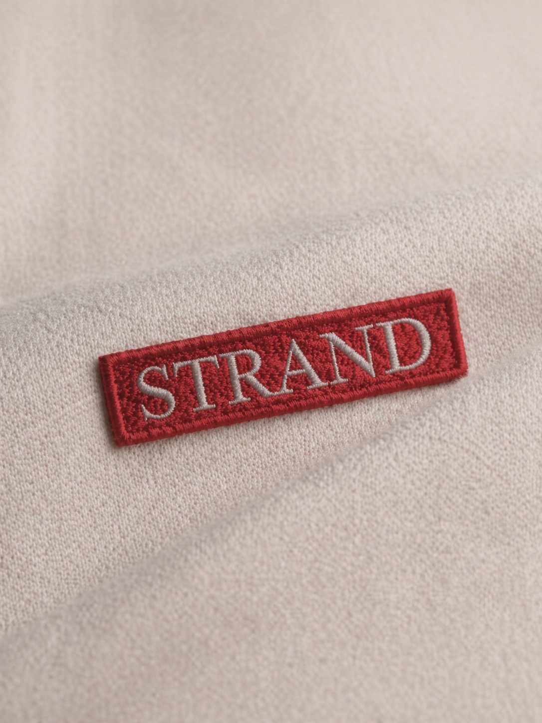 Strand logo detail
